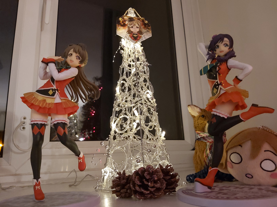 Two of my four love live figures, dancing around the christmas tree! Of course, best girl sits...